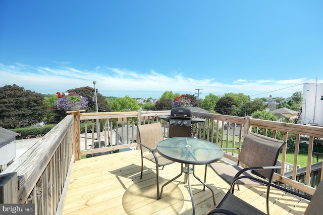 wooden deck with grilling area