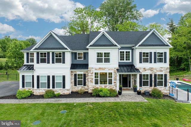 1051 Glen Hall Rd, Kennett Square, PA 19348 - view of front of property with stone siding, a standing seam roof, and a shingled roof