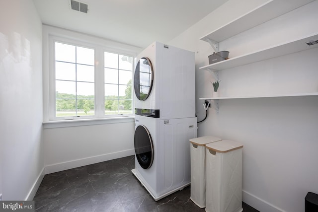 1051 Glen Hall Rd, Kennett Square, PA 19348 - laundry room with stacked washer and clothes dryer and baseboards