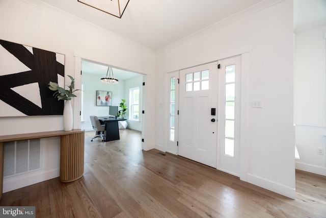 1051 Glen Hall Rd, Kennett Square, PA 19348 - entryway featuring crown molding, wood finished floors, baseboards, and a chandelier