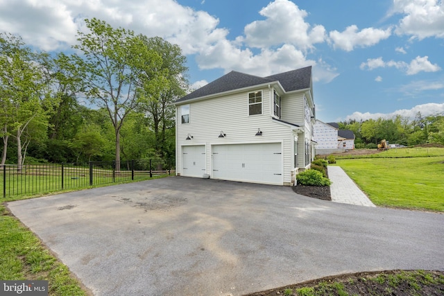 1051 Glen Hall Rd, Kennett Square, PA 19348 - view of side of property featuring asphalt driveway, a garage, and a shingled roof
