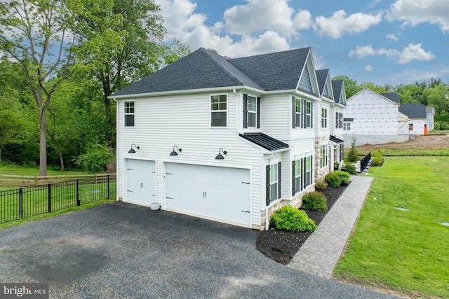 1051 Glen Hall Rd, Kennett Square, PA 19348 - view of side of home with a garage, a shingled roof, and driveway