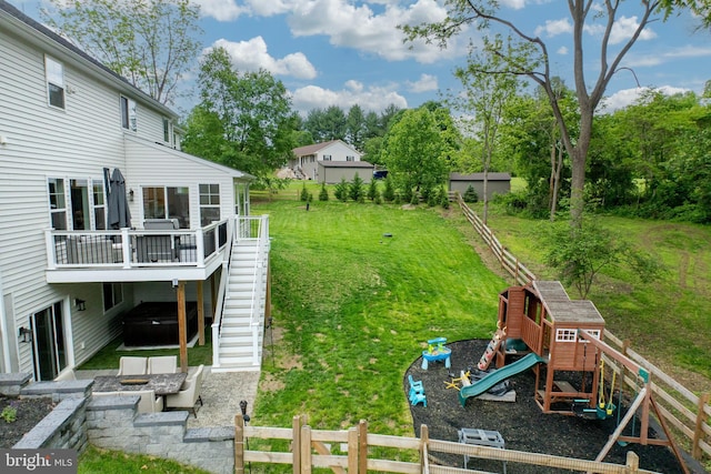 1051 Glen Hall Rd, Kennett Square, PA 19348 - view of green lawn with a playground, stairway, a wooden deck, and view of wooded area