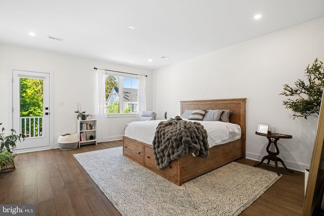 bedroom featuring wood finished floors, access to exterior, recessed lighting, and baseboards