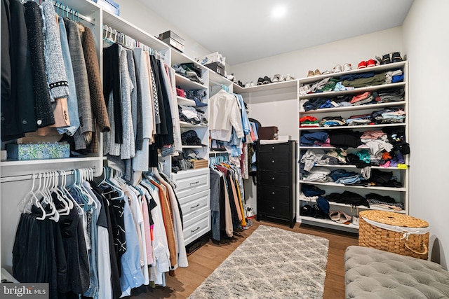 spacious closet with wood finished floors