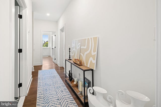 hall featuring dark wood finished floors