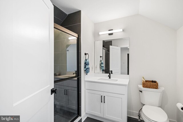 full bath with a shower stall, toilet, and vanity
