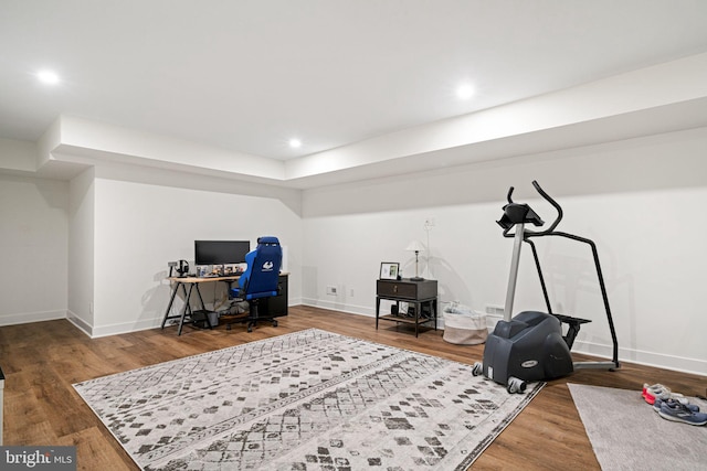 office area featuring baseboards, wood finished floors, and recessed lighting
