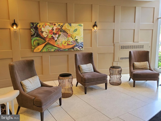 100 W Ave Unit 406S, Jenkintown, PA 19046 - living area featuring a decorative wall and tile patterned flooring