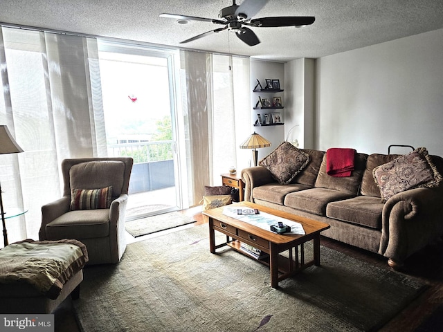 100 W Ave Unit 406S, Jenkintown, PA 19046 - living area featuring a ceiling fan and a textured ceiling