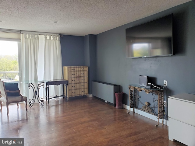 100 W Ave Unit 406S, Jenkintown, PA 19046 - living room with a textured ceiling and wood finished floors