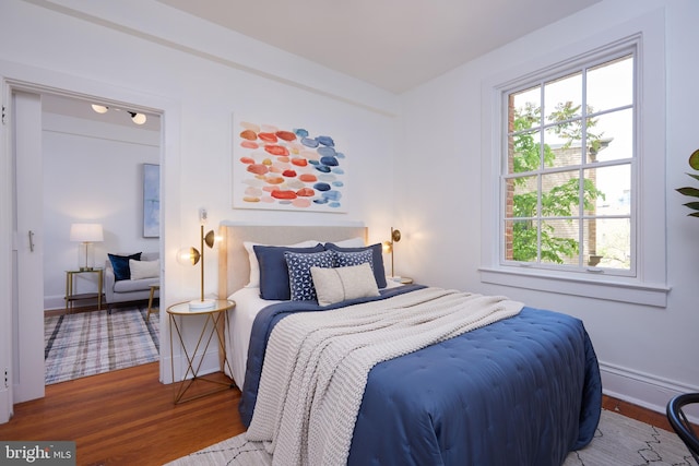 bedroom featuring wood finished floors