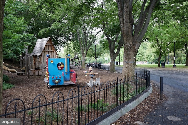 community jungle gym with fence