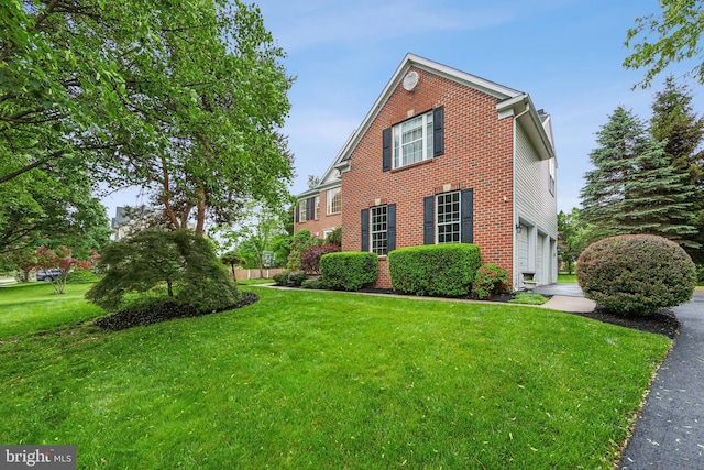 537 Tawnyberry Ln, Collegeville, PA 19426 - view of side of property featuring brick siding, a garage, and a lawn