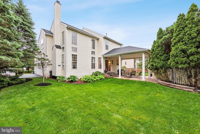 537 Tawnyberry Ln, Collegeville, PA 19426 - back of house featuring a patio and a chimney