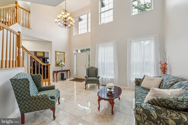 537 Tawnyberry Ln, Collegeville, PA 19426 - tiled living room featuring stairway, a chandelier, a high ceiling, and baseboards