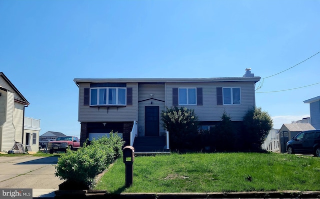 17 W Delaware Dr, Little Egg Harbor Twp, NJ 08087 - bi-level home with a garage, a front yard, driveway, and a chimney