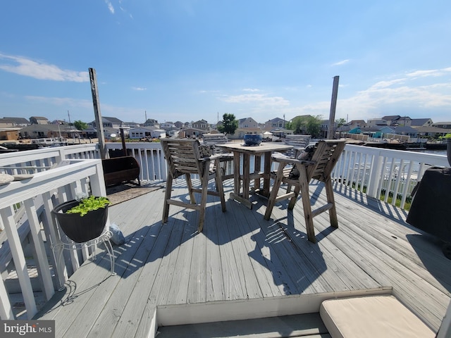 17 W Delaware Dr, Little Egg Harbor Twp, NJ 08087 - wooden deck with a residential view, a water view, and outdoor dining area