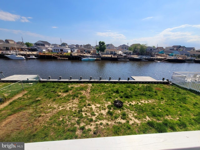 17 W Delaware Dr, Little Egg Harbor Twp, NJ 08087 - water view with nearby suburban area, a boat dock, and fence