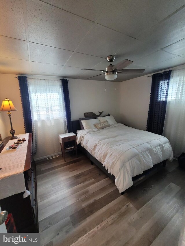 17 W Delaware Dr, Little Egg Harbor Twp, NJ 08087 - bedroom featuring wood finished floors, a paneled ceiling, and a ceiling fan