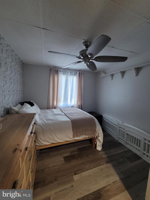 17 W Delaware Dr, Little Egg Harbor Twp, NJ 08087 - bedroom featuring wallpapered walls, a drop ceiling, wood finished floors, and a ceiling fan