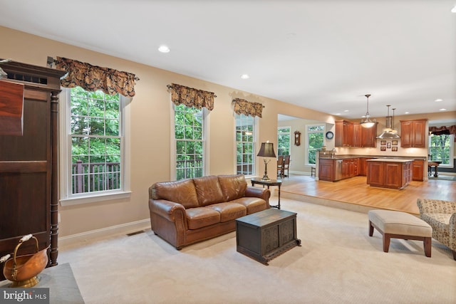 1490 Jakes Creek Dr, Woodbine, MD 21797 - living room featuring baseboards, light colored carpet, recessed lighting, and light wood-type flooring