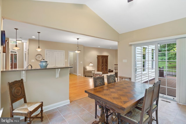 1490 Jakes Creek Dr, Woodbine, MD 21797 - dining space featuring vaulted ceiling, light tile patterned flooring, recessed lighting, and baseboards