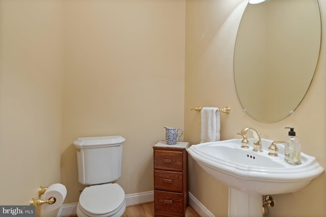 1490 Jakes Creek Dr, Woodbine, MD 21797 - half bath featuring toilet, baseboards, and a sink