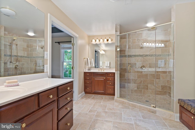 1490 Jakes Creek Dr, Woodbine, MD 21797 - bathroom featuring two vanities, a stall shower, stone finish flooring, and baseboards