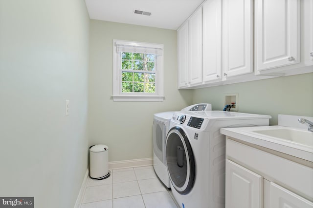 1490 Jakes Creek Dr, Woodbine, MD 21797 - laundry room with cabinet space, washer and dryer, baseboards, and light tile patterned flooring
