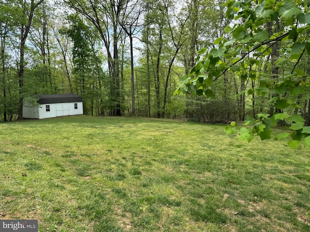 1490 Jakes Creek Dr, Woodbine, MD 21797 - view of green lawn with an outbuilding and a wooded view
