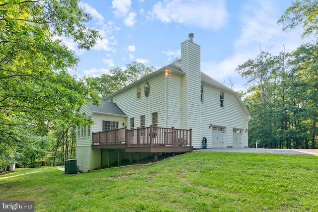 1490 Jakes Creek Dr, Woodbine, MD 21797 - rear view of property with central air condition unit, a chimney, a garage, a deck, and driveway
