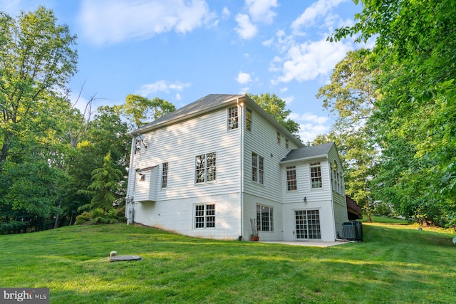 1490 Jakes Creek Dr, Woodbine, MD 21797 - back of property with cooling unit, a lawn, a patio, and brick siding