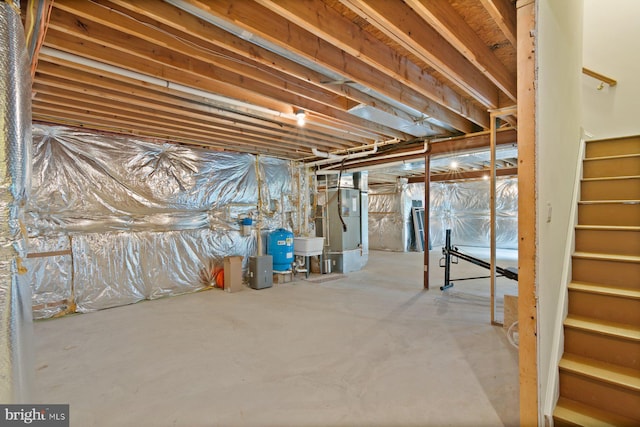 1490 Jakes Creek Dr, Woodbine, MD 21797 - unfinished below grade area with stairway, a water pressure tank, and a sink