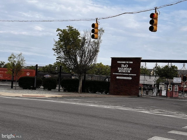 116 Callender St, Baltimore, MD 21201 - view of asphalt road with traffic lights, curbs, traffic signs, and sidewalks