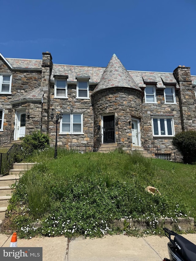 5711 Wyndale Ave, Philadelphia, PA 19131 - view of front facade with a high end roof and stone siding