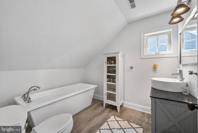 5688 Kirkpatrick Ct, Salisbury, MD 21801 - full bath with toilet, a freestanding tub, vanity, lofted ceiling, and wood finished floors