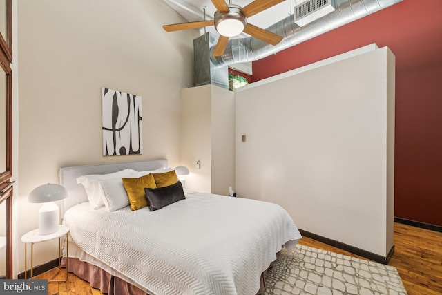 428 N 13th St Unit 3G, Philadelphia, PA 19123 - bedroom with wood finished floors, baseboards, and ceiling fan