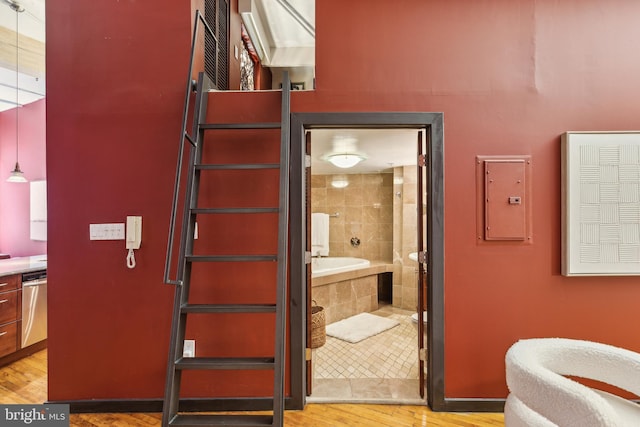 428 N 13th St Unit 3G, Philadelphia, PA 19123 - bathroom featuring wood finished floors, tiled tub, and electric panel