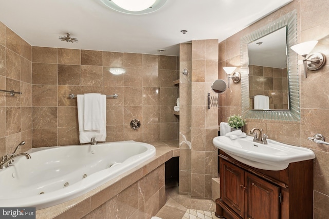428 N 13th St Unit 3G, Philadelphia, PA 19123 - full bath featuring tile walls, vanity, a tub with jets, and tile patterned floors
