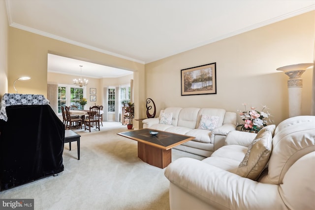 living area with a chandelier, light carpet, and crown molding