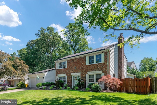 1702 Tarrytown Ave, Crofton, MD 21114 - colonial home with a chimney, asphalt driveway, an attached garage, and brick siding