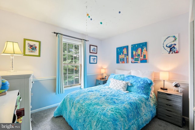 carpeted bedroom with baseboards