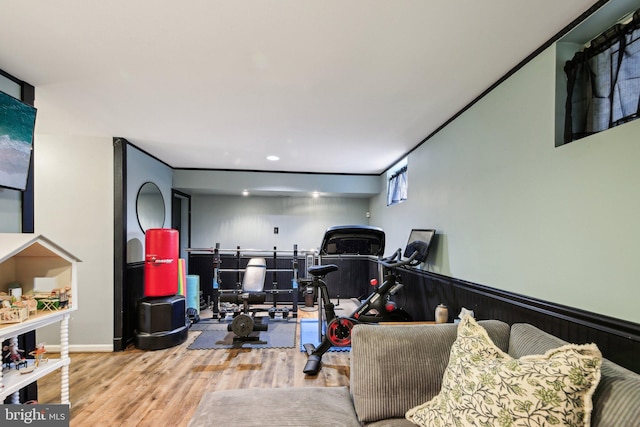 exercise room with wood finished floors, recessed lighting, and baseboards