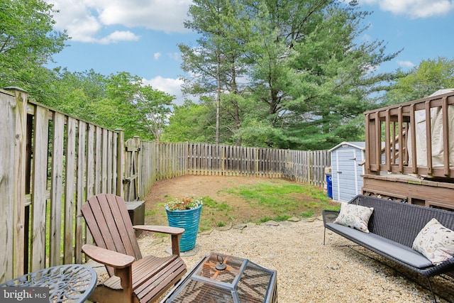 fenced backyard with a storage unit, an outdoor structure, and a patio