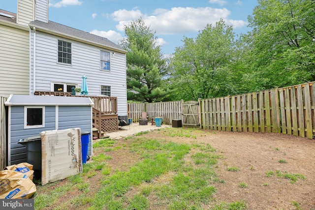 fenced backyard with a wooden deck