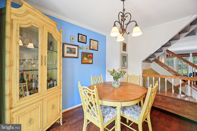 dining room featuring a chandelier, stairway, dark wood finished floors, crown molding, and baseboards