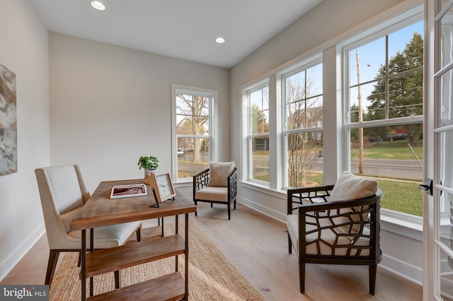 dining room featuring baseboards, recessed lighting, and light wood-type flooring