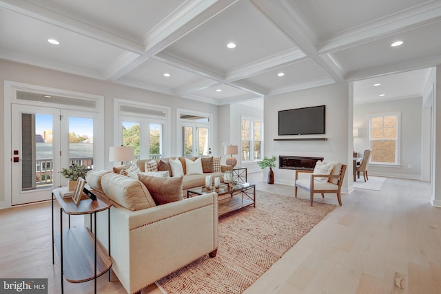 living area with coffered ceiling, beamed ceiling, recessed lighting, light wood-style floors, and baseboards