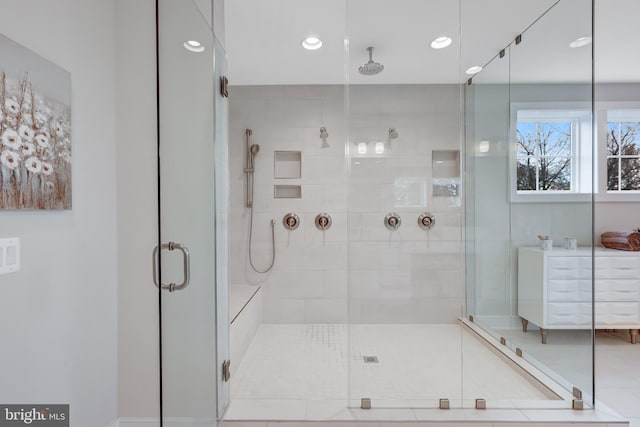 full bath with a stall shower and recessed lighting